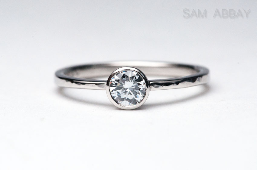Light blue cultured diamond bezel engagement ring