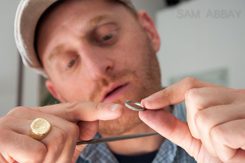 inspecting twisted wedding ring